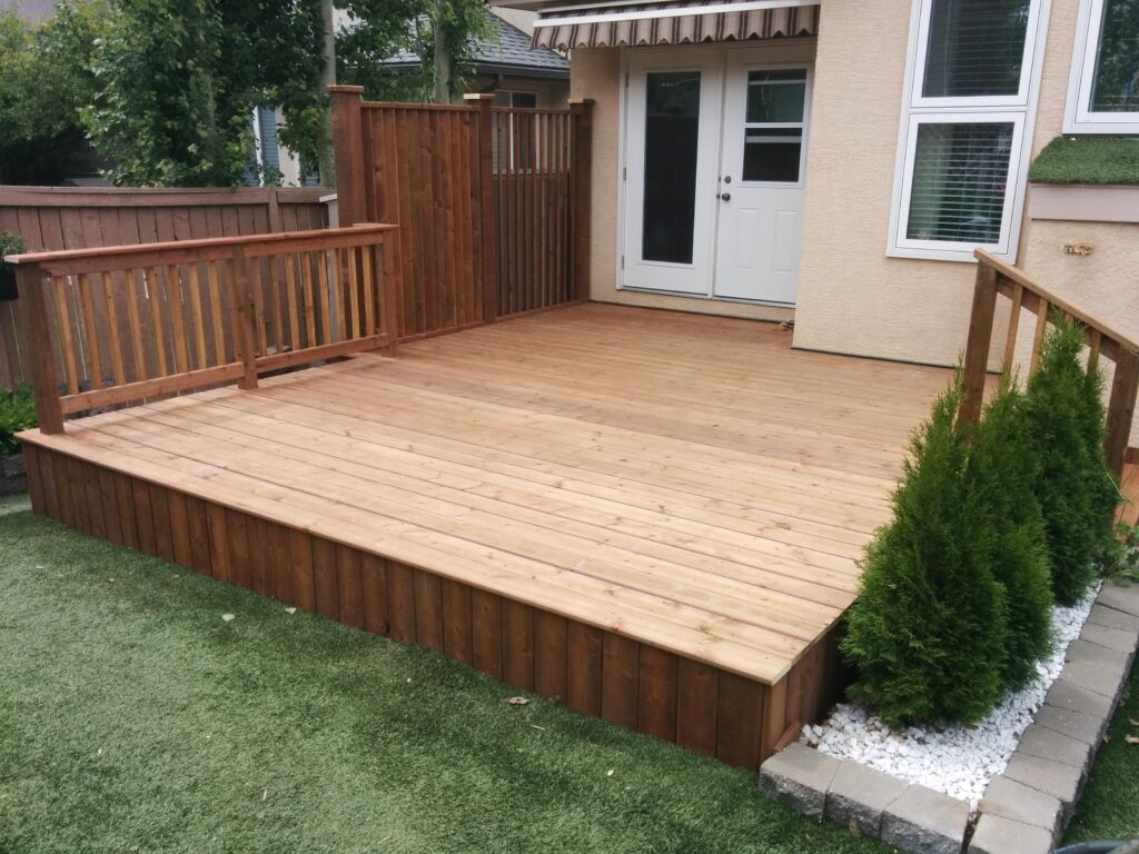 Newly built wooden deck attached to a house.