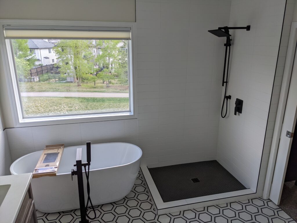 Modern bathroom with tub and walk-in shower.