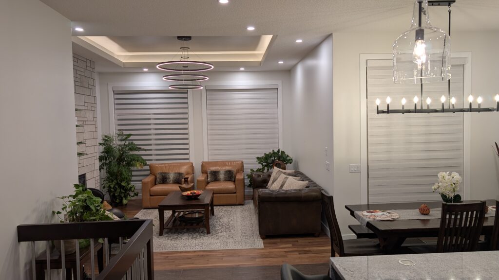 Modern living room with cozy seating and ambient lighting.