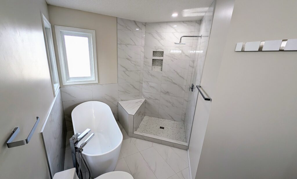 Modern bathroom with tub and glass shower.