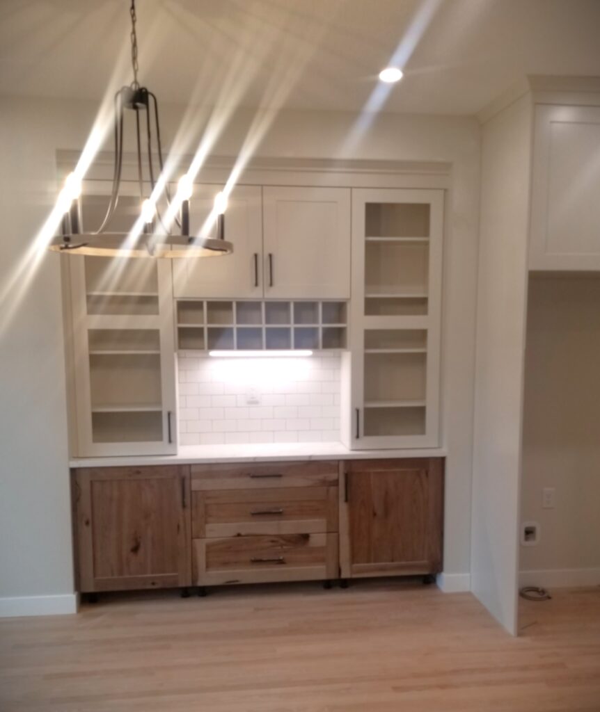 Modern kitchen cabinet with wooden accents.